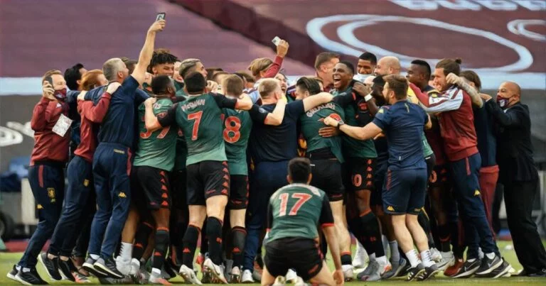 Aston Villa team celebrate survival